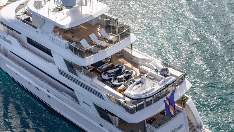 Slide: The Image of Luxurious 2014 Westport 40M yacht with spacious deck and watercrafts on a sunny day. - 20