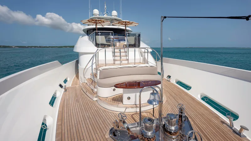 Slide: The Image of Luxurious 2014 Westport 40M yacht deck with elegant seating and ocean view. - 24