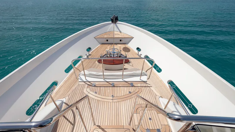 Slide: The Image of Luxurious 2014 Westport 40M yacht deck with elegant wood finish on calm blue waters. - 29