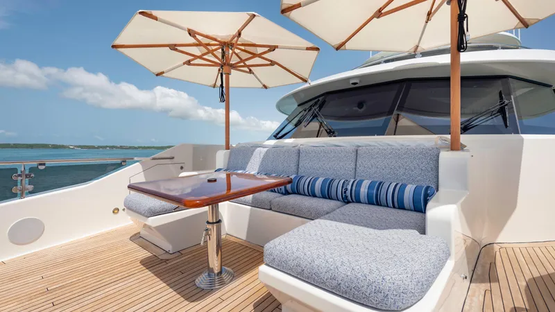 Slide: The Image of Luxurious deck seating on 2014 Westport 40M yacht with umbrellas and ocean view. - 31