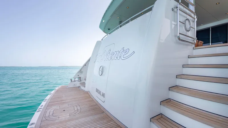 Slide: The Image of Luxury yacht Westport 40M 2014, docked with elegant wooden deck and ocean view. - 37