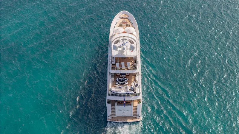 Slide: The Image of Aerial view of 2014 Westport 40M yacht cruising on clear blue water. - 4