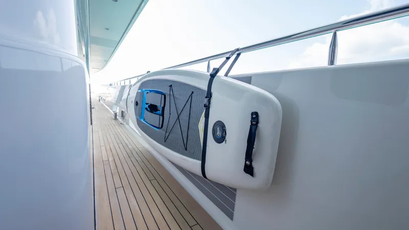 Slide: The Image of Paddleboard secured on 2014 Westport 40M yacht deck, showcasing luxury marine lifestyle. - 40