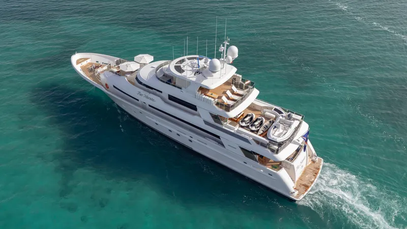 Slide: The Image of Luxurious 2014 Westport 40M yacht cruising on clear turquoise waters. - 6