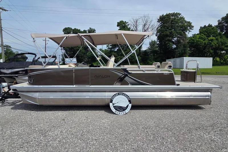 The Image of 2025 Avalon Platinum LSZ 2385 Cruise Rear Bench pontoon boat with canopy, parked outdoors. - 0