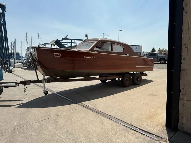 Slide: The Image of 1950 Chris-Craft 22' Custom Sedan boat on trailer at marina. - 1