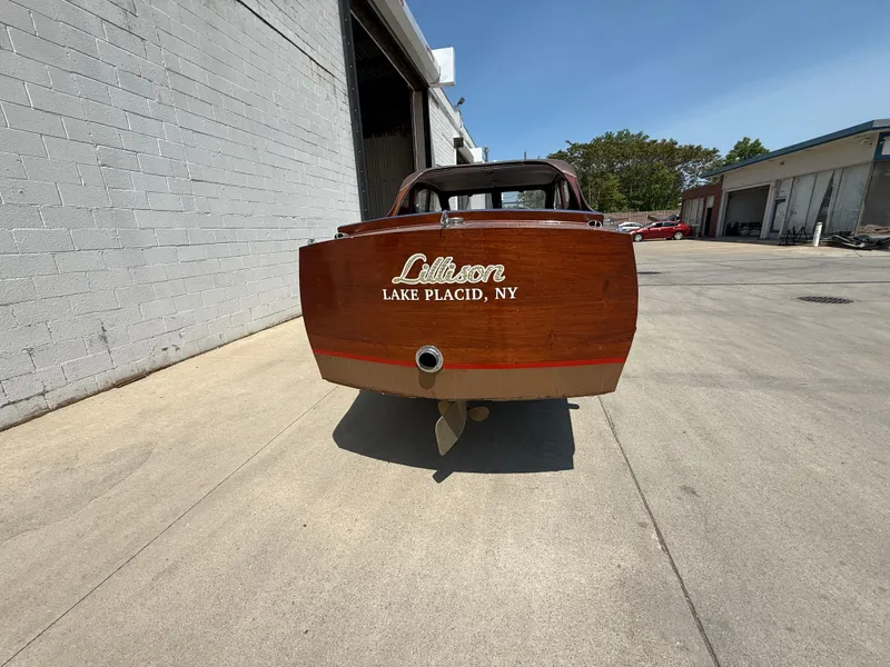 Slide: The Image of 1950 Chris-Craft 22' Custom Sedan boat, rear view, parked on concrete, Lake Placid, NY. - 14