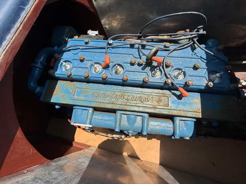 Slide: The Image of 1950 Chris-Craft 22' Custom Sedan engine, blue with visible wiring and components. - 16
