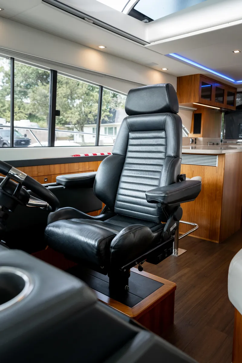 Slide: The Image of Luxurious interior of 2018 Riviera 5400 Sport Yacht with leather captain's chair. - 45