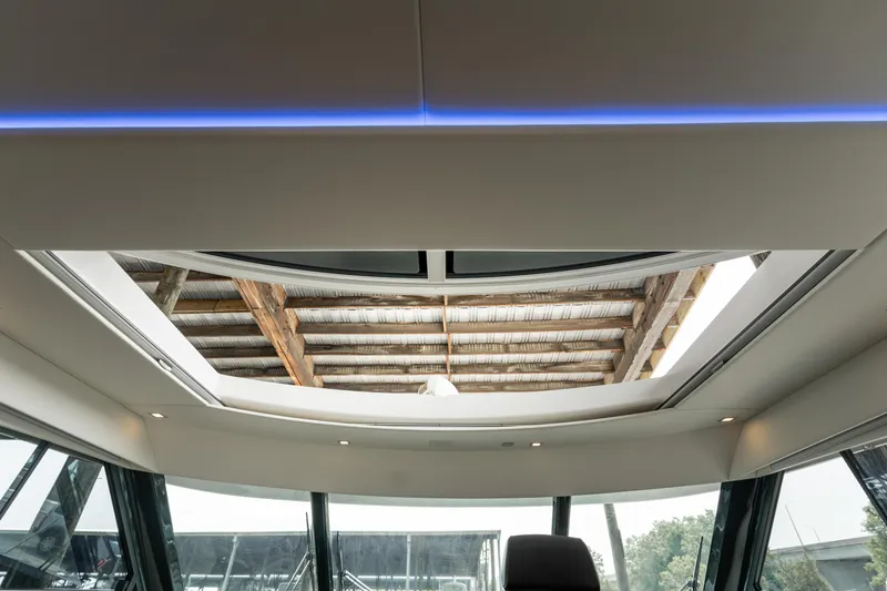 Slide: The Image of Interior view of 2018 Riviera 5400 Sport Yacht's sunroof, showcasing modern design and natural light. - 46