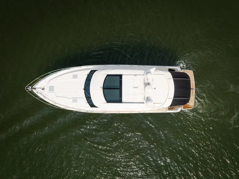 Slide: The Image of Aerial view of 2018 Riviera 5400 Sport Yacht cruising on water. - 5
