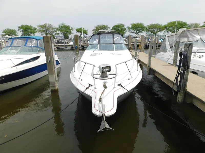 Slide: The Image of 1991 Chris-Craft 302 Crowne boat docked at marina, front view. - 3