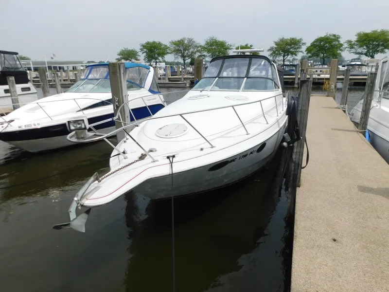 Slide: The Image of 1991 Chris-Craft 302 Crowne boat docked at marina, side view. - 4
