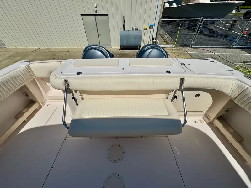 Slide: The Image of 2007 Grady-White Express 330 boat interior with seating and twin engines. - 4