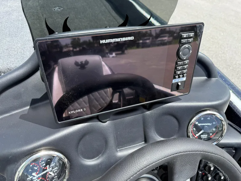 Slide: The Image of Dashboard of 2026 Phoenix 819 ZXL with Humminbird Xplore 9 display and gauges. - 10