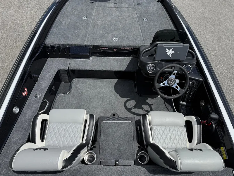 Slide: The Image of 2026 Phoenix 819 ZXL boat interior with dual seats and steering console. - 11
