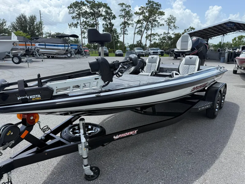 Slide: The Image of 2026 Phoenix 819 ZXL boat on trailer in outdoor lot, featuring sleek design and modern equipment. - 3