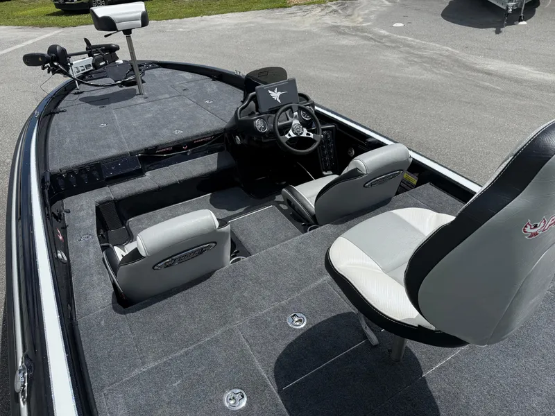 Slide: The Image of 2026 Phoenix 819 ZXL boat interior with steering console and seating. - 8