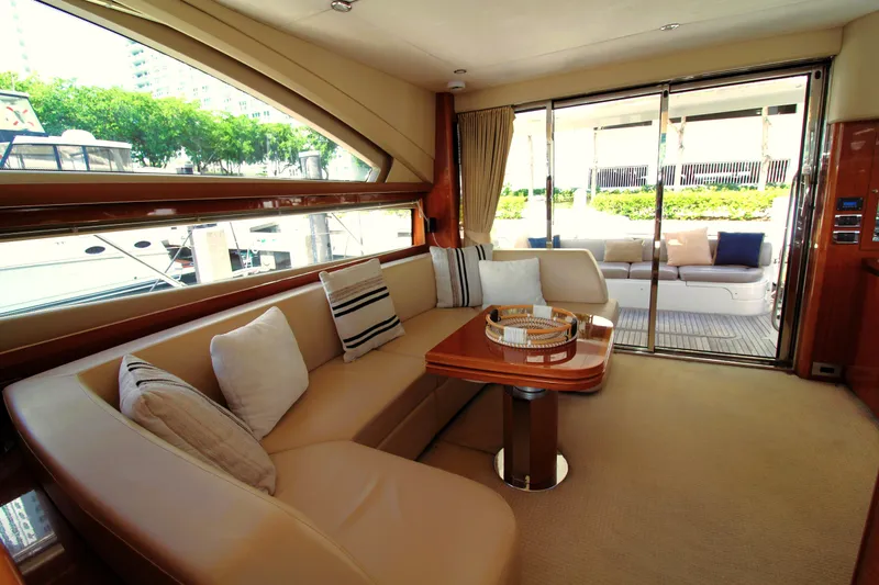 Slide: The Image of Luxurious interior of 2009 Princess F54 yacht with elegant seating and large windows. - 10