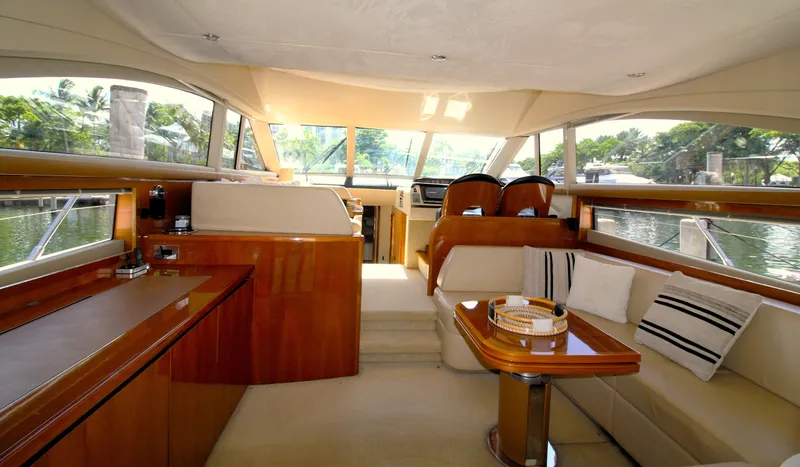 Slide: The Image of Luxurious interior of 2009 Princess F54 yacht with elegant seating and wooden finishes. - 17