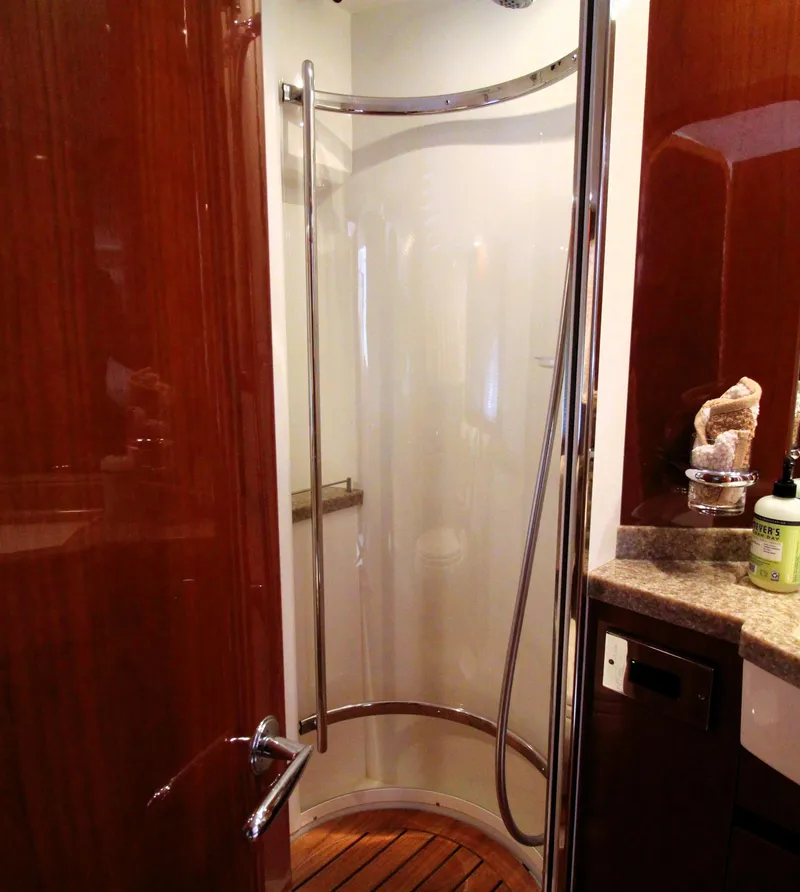 Slide: The Image of Luxurious shower area in 2009 Princess F54 yacht with wooden flooring and modern fixtures. - 20