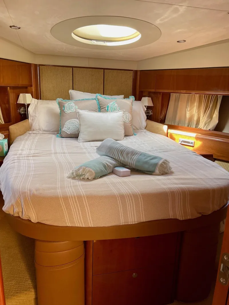 Slide: The Image of Luxurious bedroom interior of 2009 Princess F54 yacht with elegant bedding and natural light. - 22