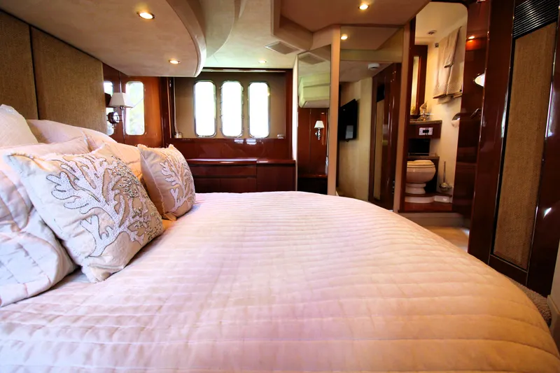 Slide: The Image of Luxurious bedroom interior of 2009 Princess F54 yacht with elegant bedding and ensuite bathroom. - 25