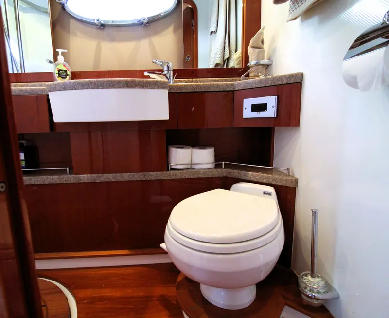 Slide: The Image of Luxurious yacht bathroom with modern fixtures, wooden cabinetry, and elegant design. Princess F54, 2009. - 27
