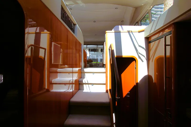 Slide: The Image of Interior of 2009 Princess F54 yacht with polished wood and carpeted stairs. - 32