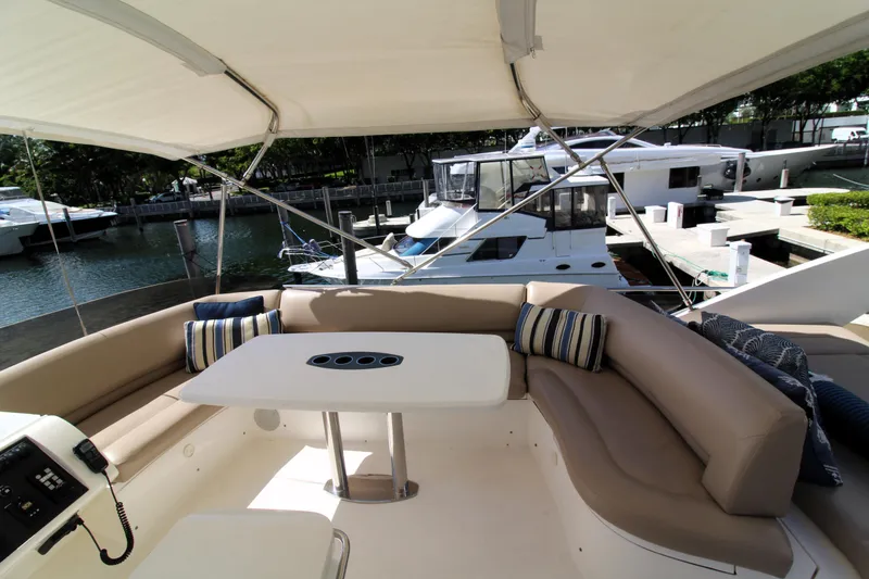 Slide: The Image of Luxurious 2009 Princess F54 yacht with elegant seating and marina view. - 34
