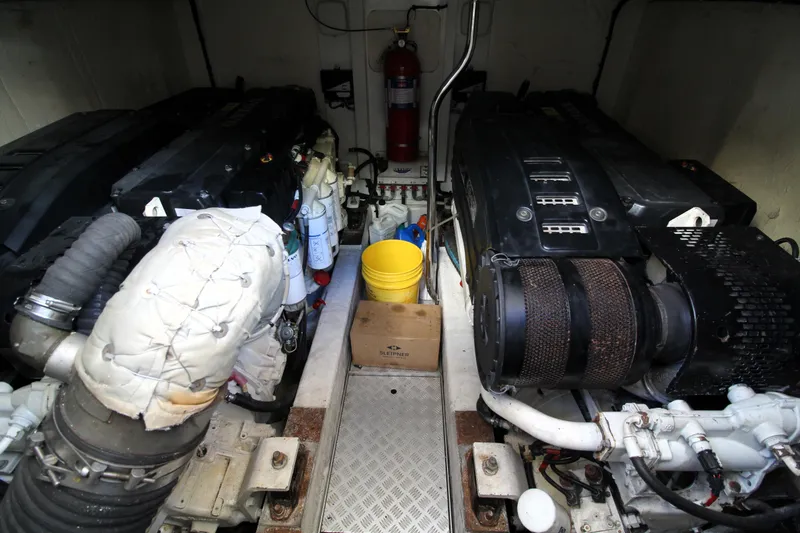 Slide: The Image of Engine room of a 2009 Princess F54 yacht with dual engines and maintenance equipment. - 40