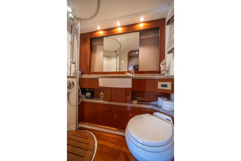 Slide: The Image of Luxurious yacht bathroom with modern fixtures, wooden accents, and elegant lighting, Princess F54 2009 model. - 44
