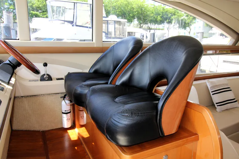 Slide: The Image of Luxurious 2009 Princess F54 yacht interior with leather seats and wooden accents. - 5