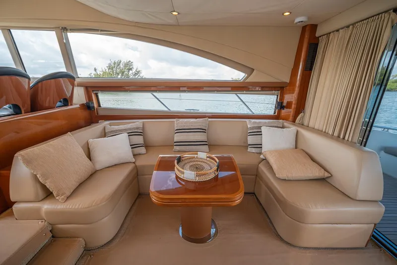 Slide: The Image of Luxurious interior of 2009 Princess F54 yacht with plush seating and elegant wooden table. - 62