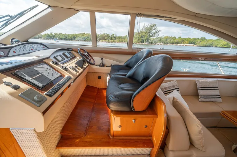 Slide: The Image of Luxurious 2009 Princess F54 yacht interior with leather seats and navigation controls. - 67