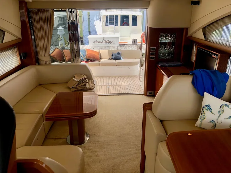 Slide: The Image of Luxurious interior of a 2009 Princess F54 yacht with elegant seating and wooden accents. - 8