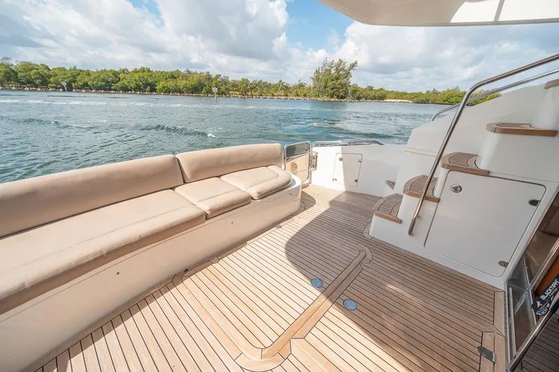 Slide: The Image of Spacious deck of 2009 Princess F54 yacht with elegant seating and scenic water view. - 80