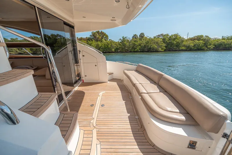 Slide: The Image of Luxurious 2009 Princess F54 yacht deck with elegant seating and scenic water view. - 84