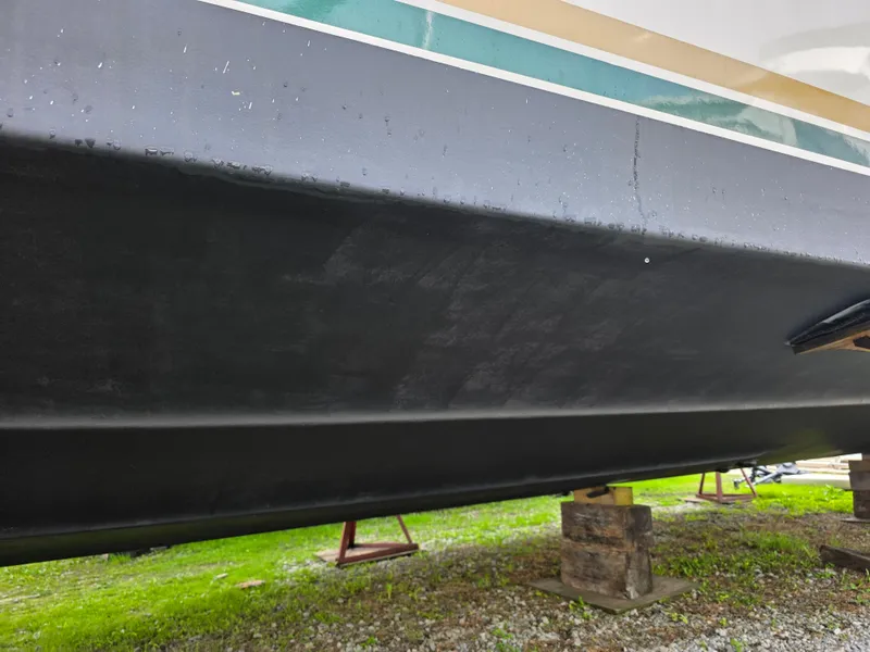Slide: The Image of 1987 Sea Ray 390 Express Cruiser hull on stands, side view. - 39