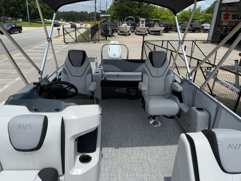 Slide: The Image of 2025 Avalon LSZ Versatile Rear Bench boat interior with modern seating and steering console. - 10