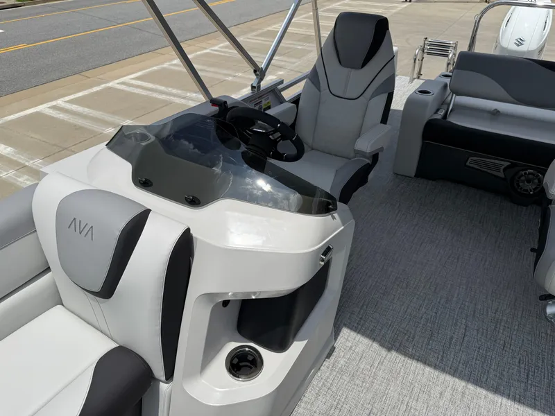 Slide: The Image of 2025 Avalon LSZ Versatile Rear Bench boat interior with modern seating and steering console. - 12