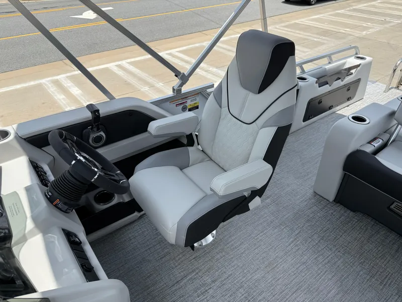 Slide: The Image of 2025 Avalon LSZ Versatile Rear Bench boat interior with modern steering and seating. - 14
