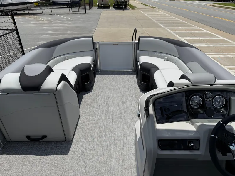 Slide: The Image of 2025 Avalon LSZ Versatile Rear Bench pontoon boat interior with modern seating and dashboard. - 17