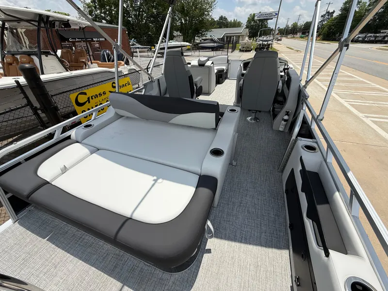 Slide: The Image of 2025 Avalon LSZ Versatile Rear Bench pontoon boat with spacious seating and modern design. - 18