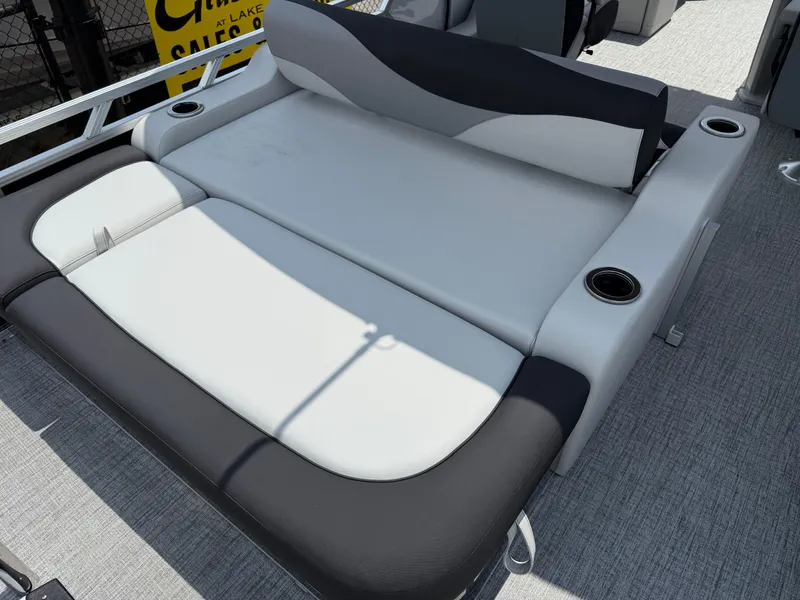 Slide: The Image of 2025 Avalon LSZ Versatile Rear Bench with cup holders on a boat deck. - 19