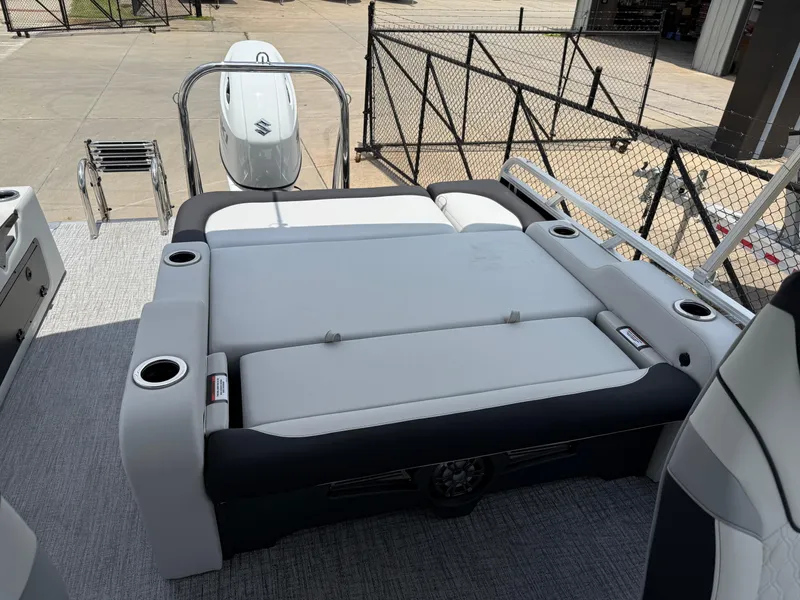 Slide: The Image of 2025 Avalon LSZ Versatile Rear Bench boat with spacious seating and cup holders. - 22