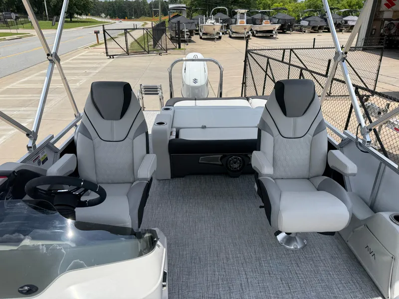 Slide: The Image of 2025 Avalon LSZ Versatile Rear Bench boat interior with modern seating and steering console. - 23