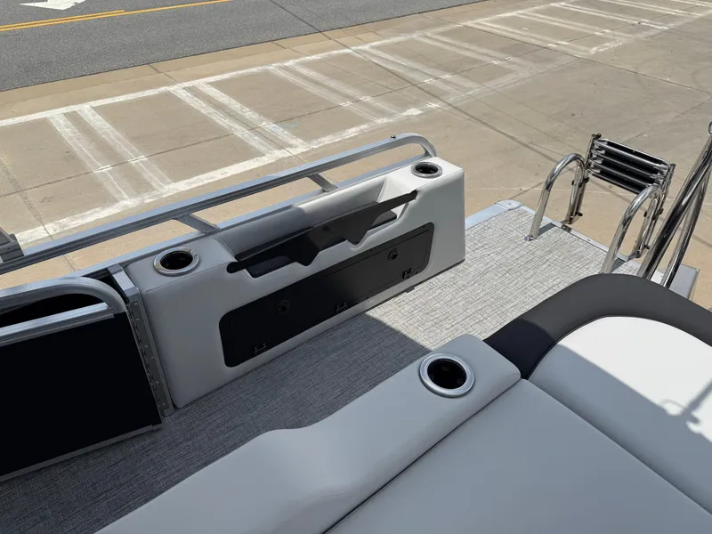 Slide: The Image of 2025 Avalon LSZ Versatile Rear Bench boat with sleek seating and cup holders. - 26