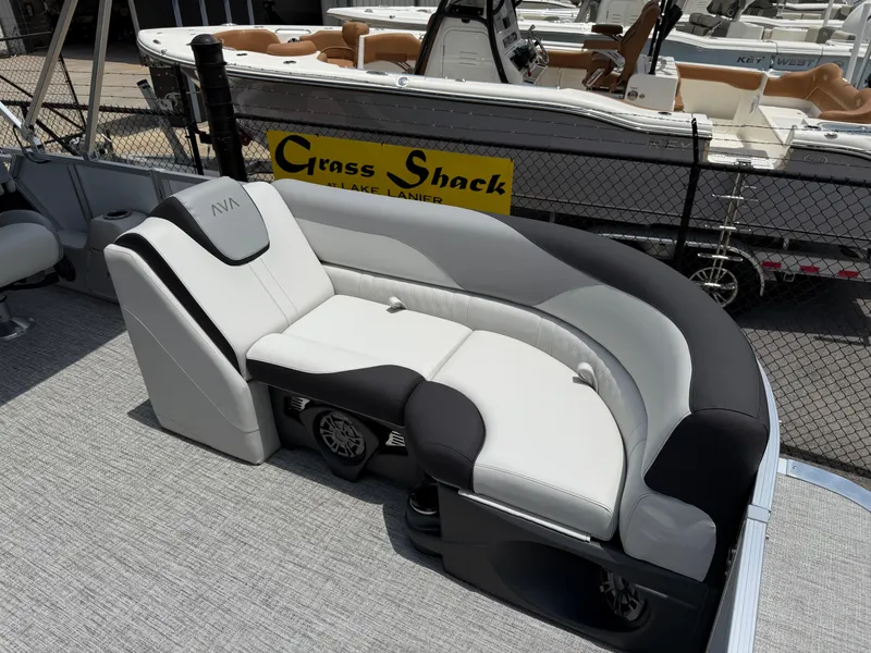 Slide: The Image of 2025 Avalon LSZ Versatile Rear Bench with sleek design and comfortable seating on a pontoon boat. - 9