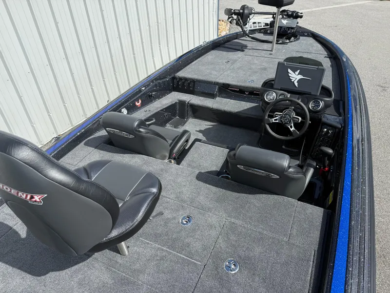 Slide: The Image of 2026 Phoenix 919 ZXL boat interior with dual seats and steering console. - 10
